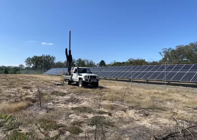 A Probe Geotech engineer preps for a land survey amidst lush Melbourne greenery, their trusty Toyota Landcruiser and drill rig standing by. Uncover solid foundations for your project – choose Probe Geotech's reliable surveying services.