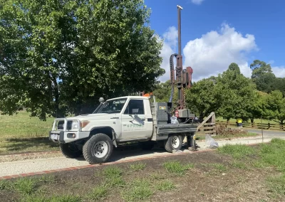 Probe Geotech's geotechnical drill rig, mounted on a trusty Toyota Landcruiser, meticulously analyzes the green haven of Berwick, Melbourne, paving the way for a durable and sustainable pavement design.