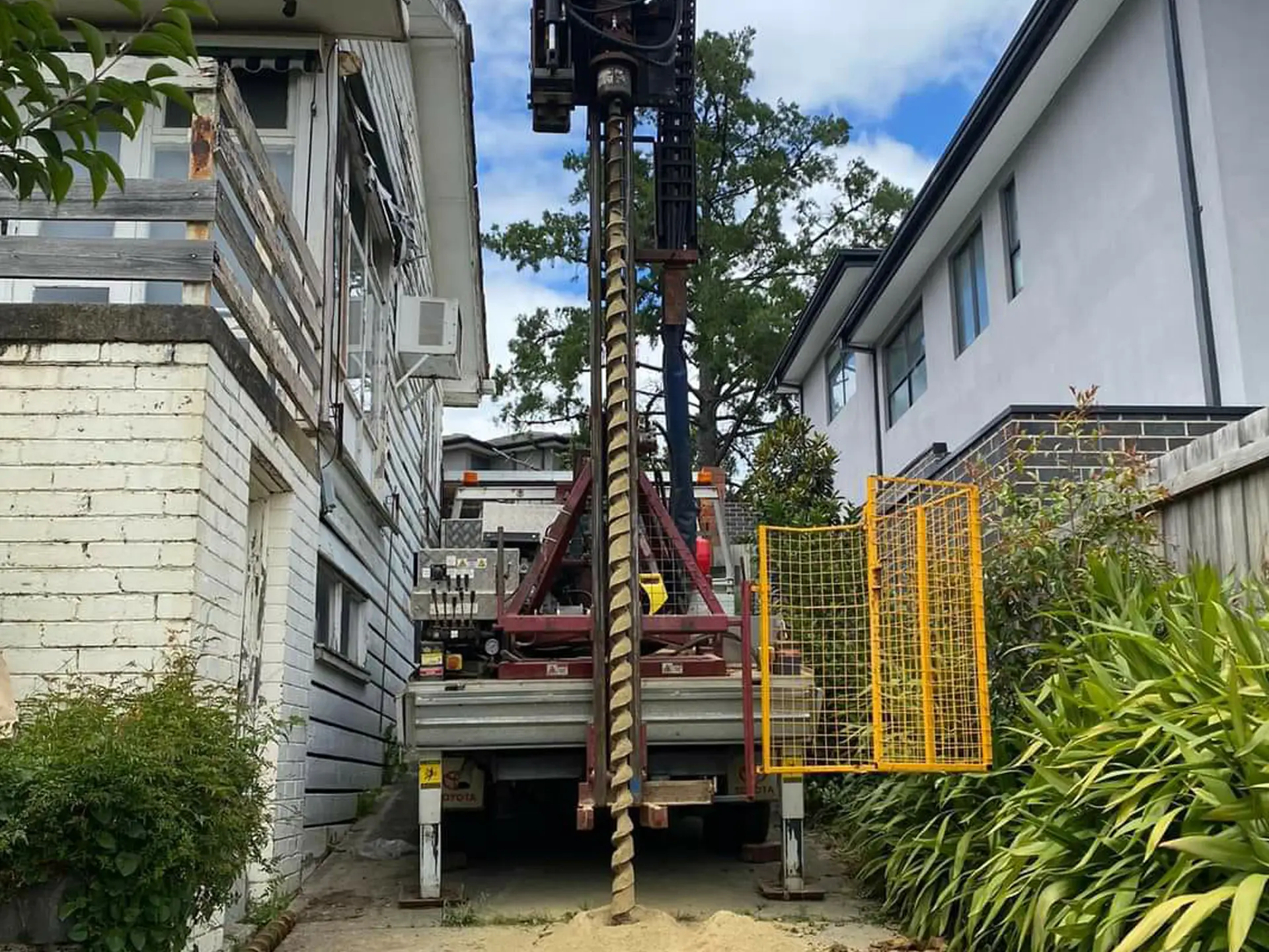 A powerful drill rig attached to a Probe Geotech Toyota Landcruiser meticulously conducts a residential soil test in Melbourne, revealing crucial data for confident foundation design.